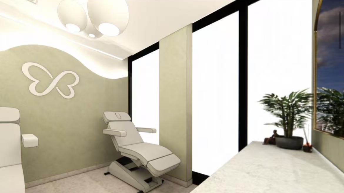 Signature facial room with butterfly logo feature wall